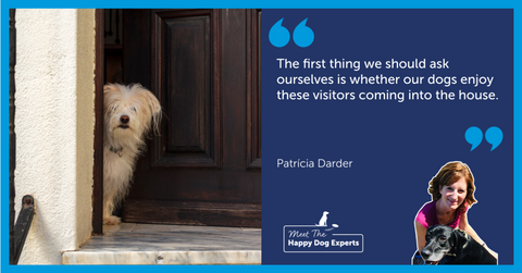 Small white dog peeking out the front door.